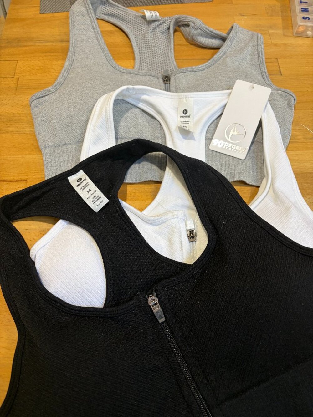 3   90 DEGREE SPORT BRAS  MEDIUM SIZE BLACK WHITE AND GRAY